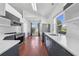 Modern kitchen featuring stainless steel appliances, a bright window view, and gray cabinetry at 3203 Herons Point Cir, Kissimmee, FL 34741