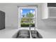 Kitchen sink view with stainless steel sink and faucet plus a view to the outdoor landscape at 3203 Herons Point Cir, Kissimmee, FL 34741