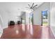 Large living room with hardwood floors, high ceilings, large windows, and access to the outdoor patio at 3203 Herons Point Cir, Kissimmee, FL 34741