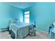 Bedroom with ample natural light, a comfortable bed, and tasteful decor at 330 Chiquita Ct, Kissimmee, FL 34758