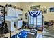 Bonus room with wet bar, cabinets, and shelving, perfect for entertaining or hobbies at 330 Chiquita Ct, Kissimmee, FL 34758
