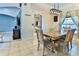 Dining room features a wooden table with chairs and a light fixture hanging above the table at 330 Chiquita Ct, Kissimmee, FL 34758