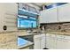 Kitchen featuring granite countertops, stainless steel dishwasher and a view to the backyard at 330 Chiquita Ct, Kissimmee, FL 34758