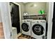 Convenient laundry room featuring a modern washer and dryer set for easy chore management at 330 Chiquita Ct, Kissimmee, FL 34758