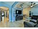 Inviting living room featuring a modern entertainment center and vaulted ceiling at 330 Chiquita Ct, Kissimmee, FL 34758