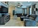 Comfortable living room featuring a decorative entertainment center and vaulted ceiling at 330 Chiquita Ct, Kissimmee, FL 34758