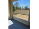 View from the screened-in patio looking out at the dry backyard at 4855 Coral Castle Dr, Kissimmee, FL 34746