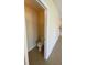 Compact powder room featuring a white toilet and neutral wall paint at 4855 Coral Castle Dr, Kissimmee, FL 34746