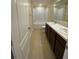 Bathroom featuring tile flooring, double sinks, and a shower/tub combo with tiled walls at 4855 Coral Castle Dr, Kissimmee, FL 34746