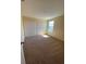 Neutral bedroom featuring carpet and double-door closet at 4855 Coral Castle Dr, Kissimmee, FL 34746