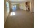 Expansive living area with tile flooring, large windows, and easy access to the backyard at 4855 Coral Castle Dr, Kissimmee, FL 34746
