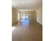 Bright, open-concept living area featuring neutral walls and lots of natural light at 4855 Coral Castle Dr, Kissimmee, FL 34746