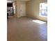Bright, open-concept living area showcasing tile flooring and lots of natural light at 4855 Coral Castle Dr, Kissimmee, FL 34746