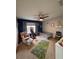 bedroom featuring a patterned rug, chair with ottoman, and a small play area at 4981 Alita Ter, St Cloud, FL 34769
