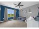 Comfortable bedroom with a ceiling fan, large window and ample space for rest and relaxation at 4981 Alita Ter, St Cloud, FL 34769