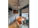 Cozy dining nook featuring built-in bench seating and a sunlit window, creating a warm atmosphere at 4981 Alita Ter, St Cloud, FL 34769