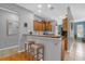Cozy eat-in kitchen featuring wood cabinets, breakfast bar with seating and modern stainless appliances at 4981 Alita Ter, St Cloud, FL 34769