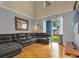 Well-lit living room features a comfortable sectional, hardwood floors and vaulted ceiling at 4981 Alita Ter, St Cloud, FL 34769