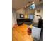 Bright living room with hardwood floors, vaulted ceilings, and a comfortable sectional, ideal for relaxation at 4981 Alita Ter, St Cloud, FL 34769