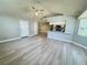 Well-lit living room showcasing neutral walls, light-colored floors, and an open layout leading to the kitchen at 5017 Laguna Bay Cir # 96, Kissimmee, FL 34746