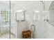 Bathroom with a glass shower, white vanity, and stylish tile flooring at 517 Milano Rd, Poinciana, FL 34759