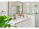Bathroom vanity with a granite counter, modern fixtures, and a glass-enclosed shower at 517 Milano Rd, Poinciana, FL 34759