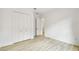 Spacious bedroom featuring a closet, wood-look floors, and neutral walls at 517 Milano Rd, Poinciana, FL 34759