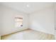 Bedroom featuring wood-look floors, a window, and a neutral paint color at 517 Milano Rd, Poinciana, FL 34759