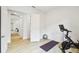 Bonus room area with wood-look floors and a Peloton bike at 517 Milano Rd, Poinciana, FL 34759