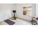 Bright exercise room with natural light and wood floors, perfect for a home gym setup at 517 Milano Rd, Poinciana, FL 34759