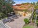 Charming home featuring a three-car garage, brick-paved driveway, and mature landscaping at 517 Milano Rd, Poinciana, FL 34759