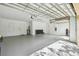 Bright, clean garage featuring epoxy floors, white walls, and utility connections at 517 Milano Rd, Poinciana, FL 34759