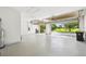 Spacious garage with epoxy floor, ample storage, and access to the outdoors at 517 Milano Rd, Poinciana, FL 34759