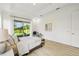 Bright main bedroom with a sliding door to the backyard seating area at 517 Milano Rd, Poinciana, FL 34759
