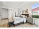 Main bedroom boasting white trim, a sitting area, and access to the ensuite bathroom at 517 Milano Rd, Poinciana, FL 34759