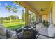 Screened-in patio featuring a fire pit and beautiful lake views at 517 Milano Rd, Poinciana, FL 34759