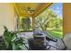 A covered patio with a fire pit and comfortable seating at 517 Milano Rd, Poinciana, FL 34759