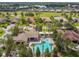 Gorgeous aerial view of the community pool, with ample lounge chairs and surrounding landscaping at 517 Milano Rd, Poinciana, FL 34759