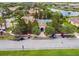 Aerial view of the community pool, showcasing the building, pool, and surrounding landscaping at 517 Milano Rd, Poinciana, FL 34759