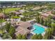 Beautiful aerial view of community pool with sun loungers and lush tropical landscaping at 517 Milano Rd, Poinciana, FL 34759