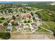 View of a quiet residential area with tree-lined streets, homes with spacious lots, and nearby highways at 6006 Country Walk Ln, Winter Haven, FL 33880