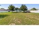 Large lot, enclosed with a white fence, with a shed, truck, and trailer on the property at 6006 Country Walk Ln, Winter Haven, FL 33880