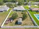 Large lot, enclosed with a white fence, with a shed, truck, and trailer on the property at 6006 Country Walk Ln, Winter Haven, FL 33880