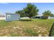 Large backyard featuring a storage shed with ample room for gardening at 6006 Country Walk Ln, Winter Haven, FL 33880