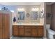 Spacious bathroom features a double sink vanity with updated fixtures and great lighting at 6006 Country Walk Ln, Winter Haven, FL 33880