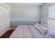 Comfortable bedroom featuring a white ceiling fan, a bed and a closet at 6006 Country Walk Ln, Winter Haven, FL 33880