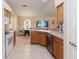 Spacious kitchen with tile flooring, stainless steel appliances, and wood cabinetry at 6006 Country Walk Ln, Winter Haven, FL 33880