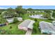 Charming community with pond views, lush landscaping, and colorful homes in a serene setting at 6044 Grand Oaks Se Dr, Winter Haven, FL 33884