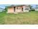 Charming home with a well-maintained yard and covered patio at 6044 Grand Oaks Se Dr, Winter Haven, FL 33884