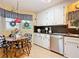 Bright kitchen with stainless steel appliances and an eat-in dining area at 6044 Grand Oaks Se Dr, Winter Haven, FL 33884